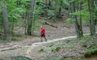 Trail runner at Lincoln Woods State Park